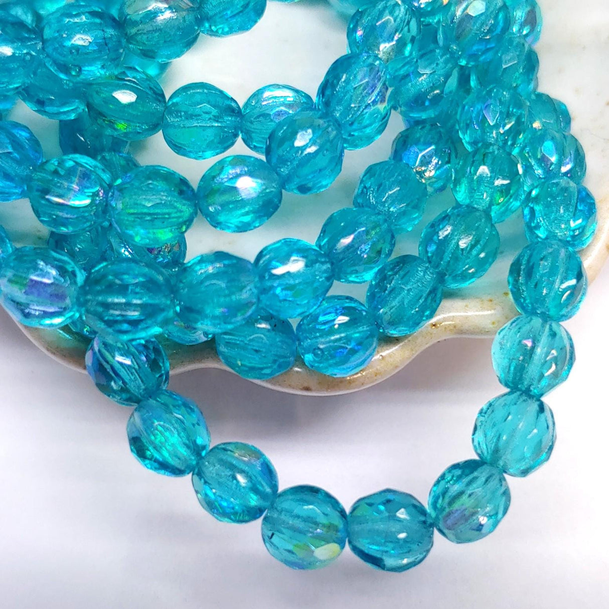 6mm Faceted Melon Sky Blue w/AB Finish-25 Beads