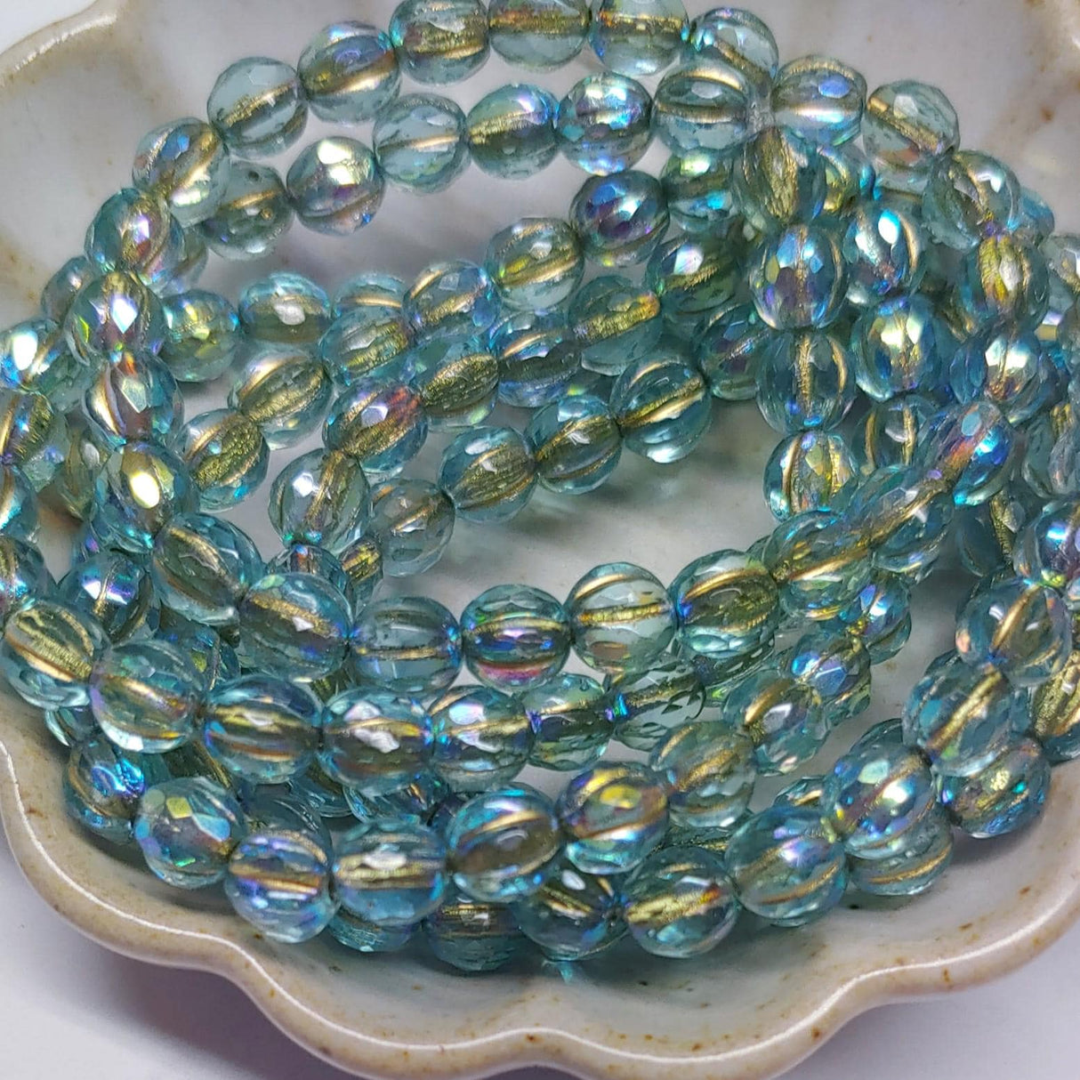 6mm Faceted Melon Baby Blue w/AB Finish & Gold Wash-25 Beads