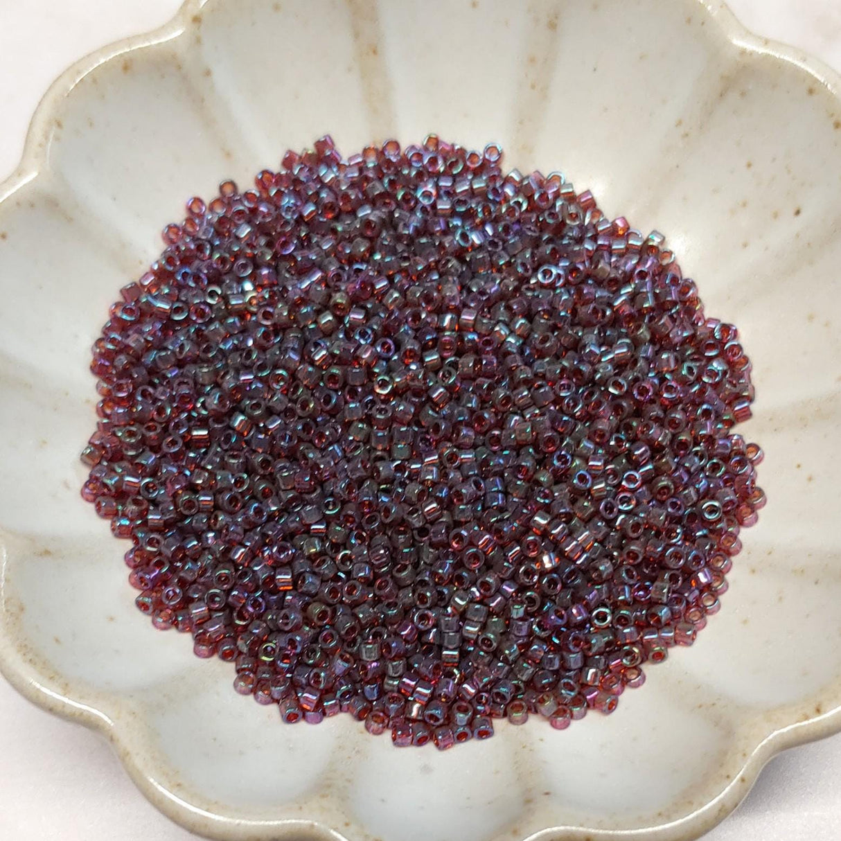 DB0104 11/0 Claret Rainbow Gold Luster Miyuki Delica