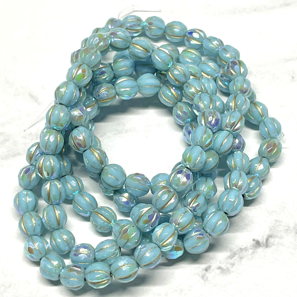 6mm Faceted Melon Sky Blue w/Rainbow AB Finish and Gold Wash-25 Beads